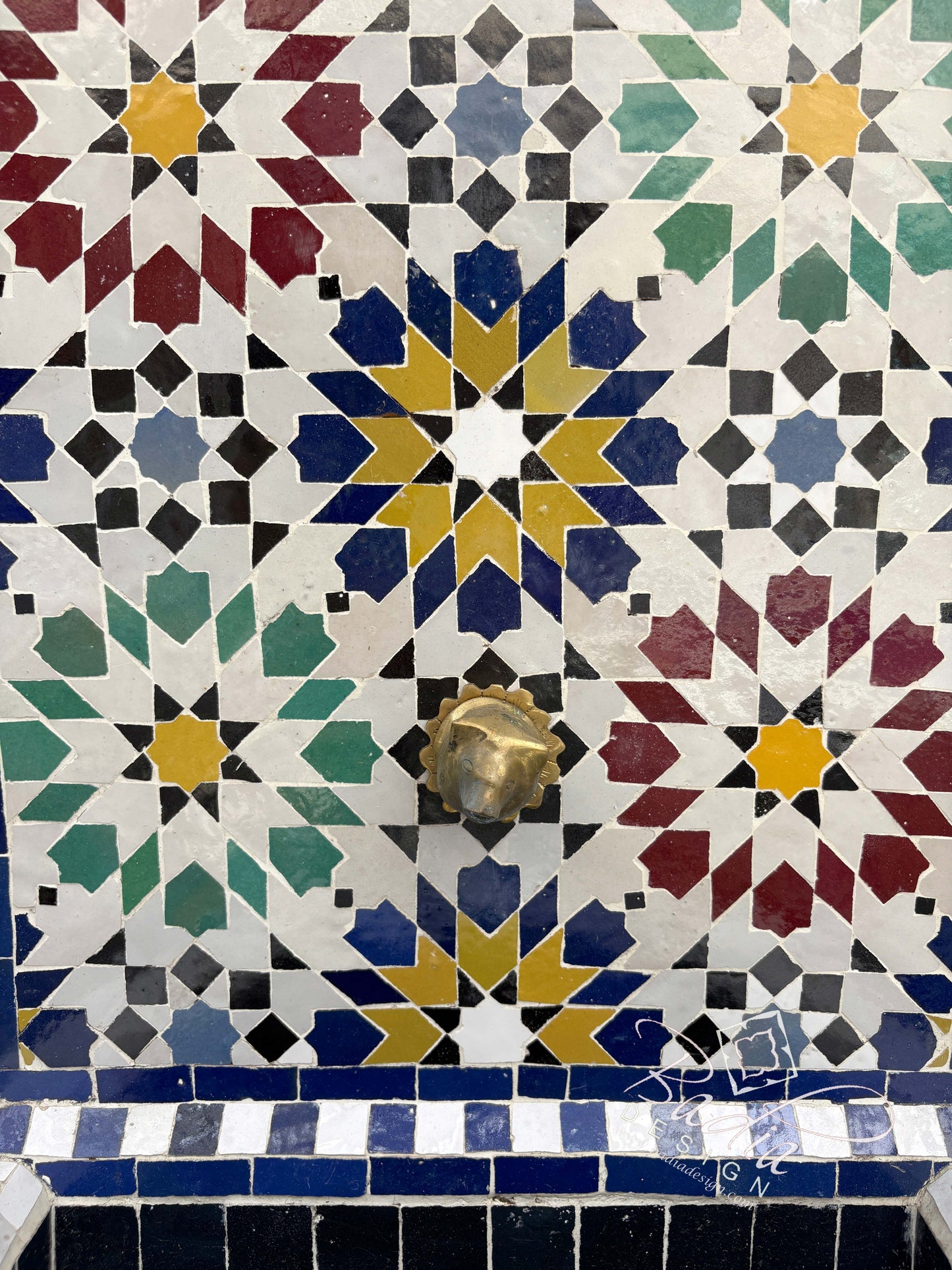 Multi-Color Water Fountain with an Arch Top