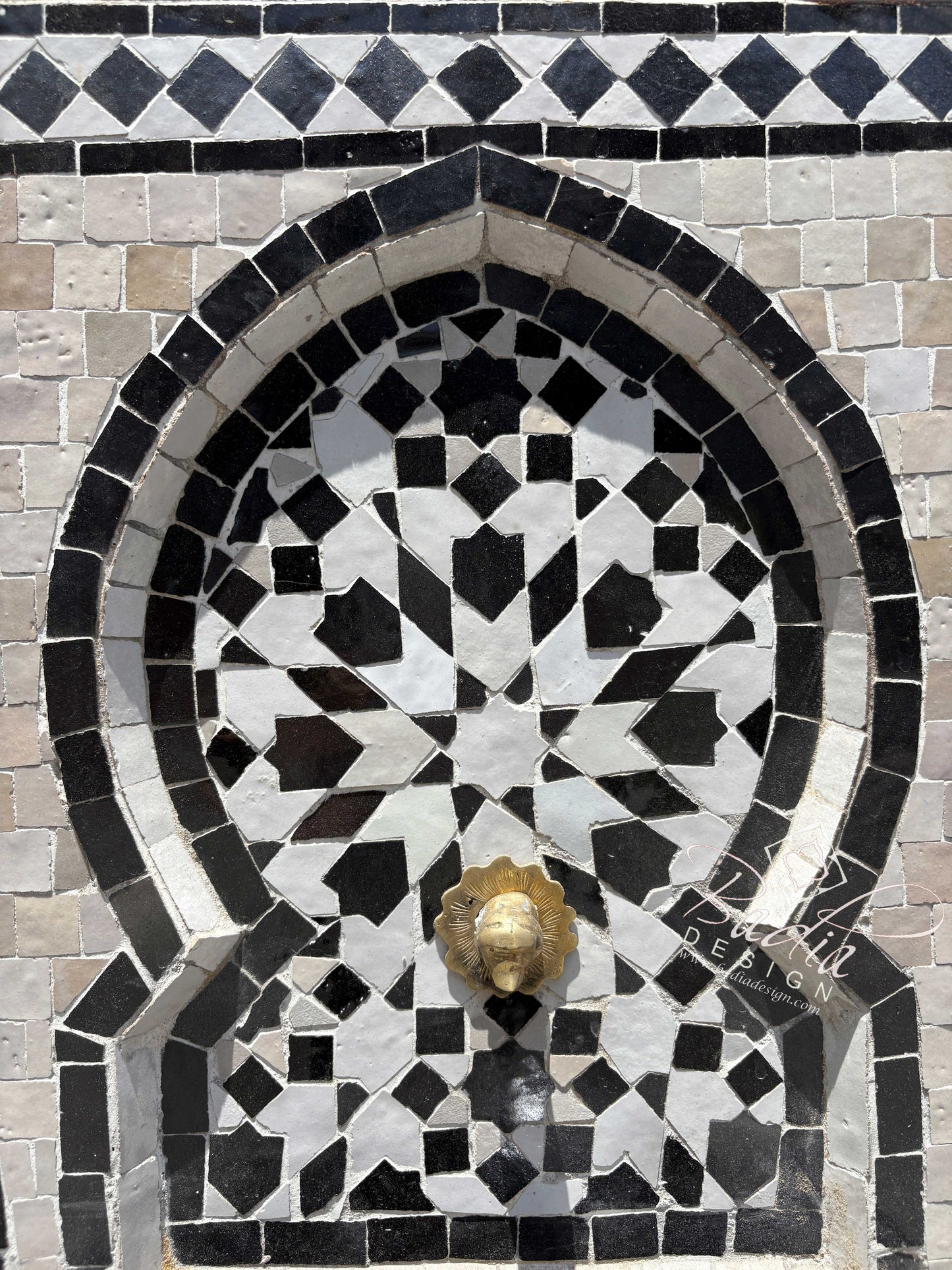 Small Brown and Beige Tile Water Fountain